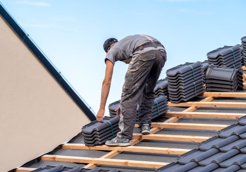 new-roof-family-house-roofer-builds-roof-made-ceramic-tiles-min